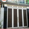 Cửa cổng sắt 4 cánh giả gỗ đẹp, hiện đại - Tập Đoàn Việt cua cong sat 4 canh gia go 1